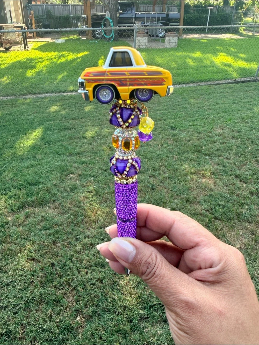 Lowrider 64 Impala Car Tuned Topper Pen with Purple and Yellow Accents.